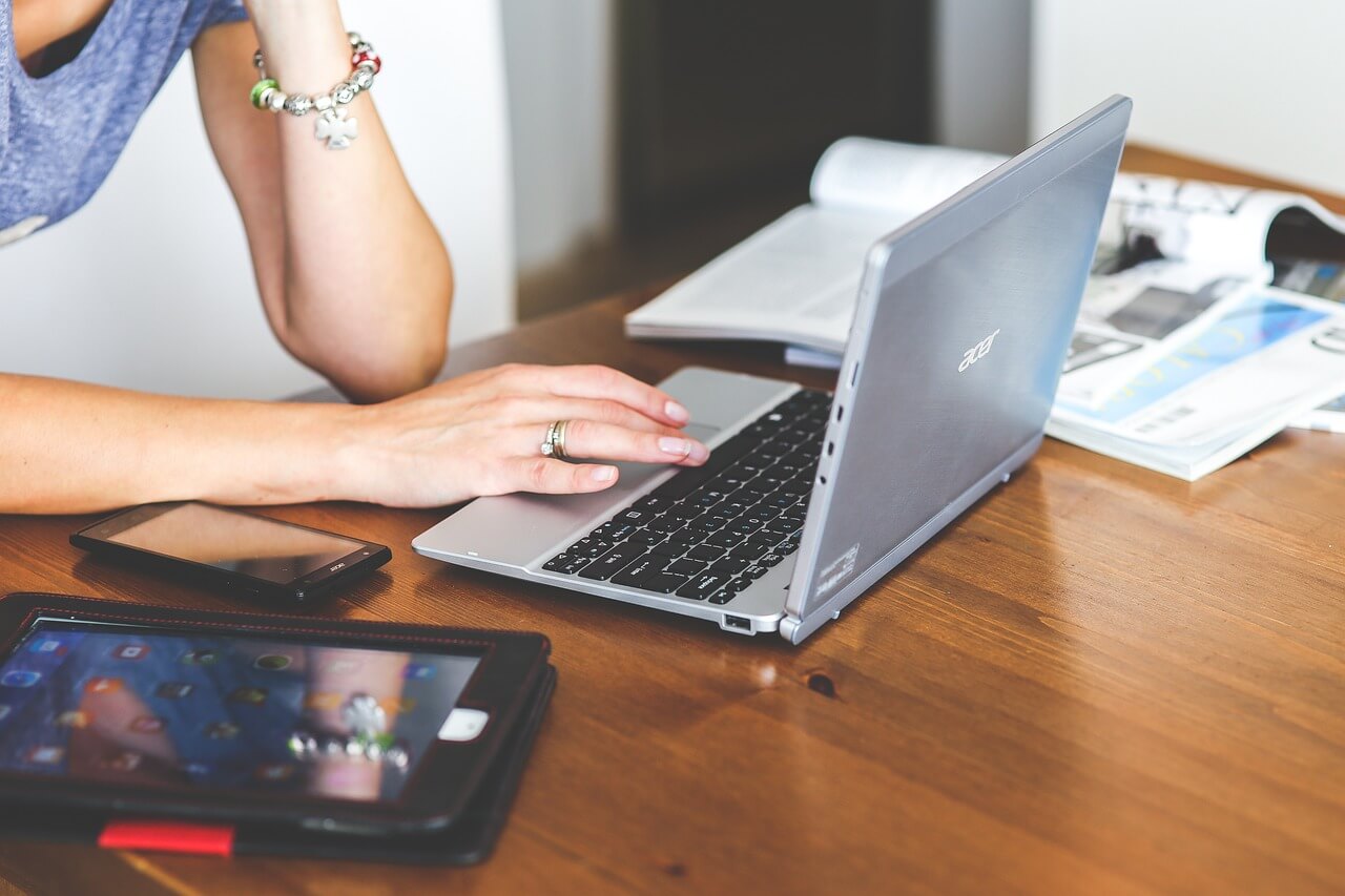 Woman working on ACER computer